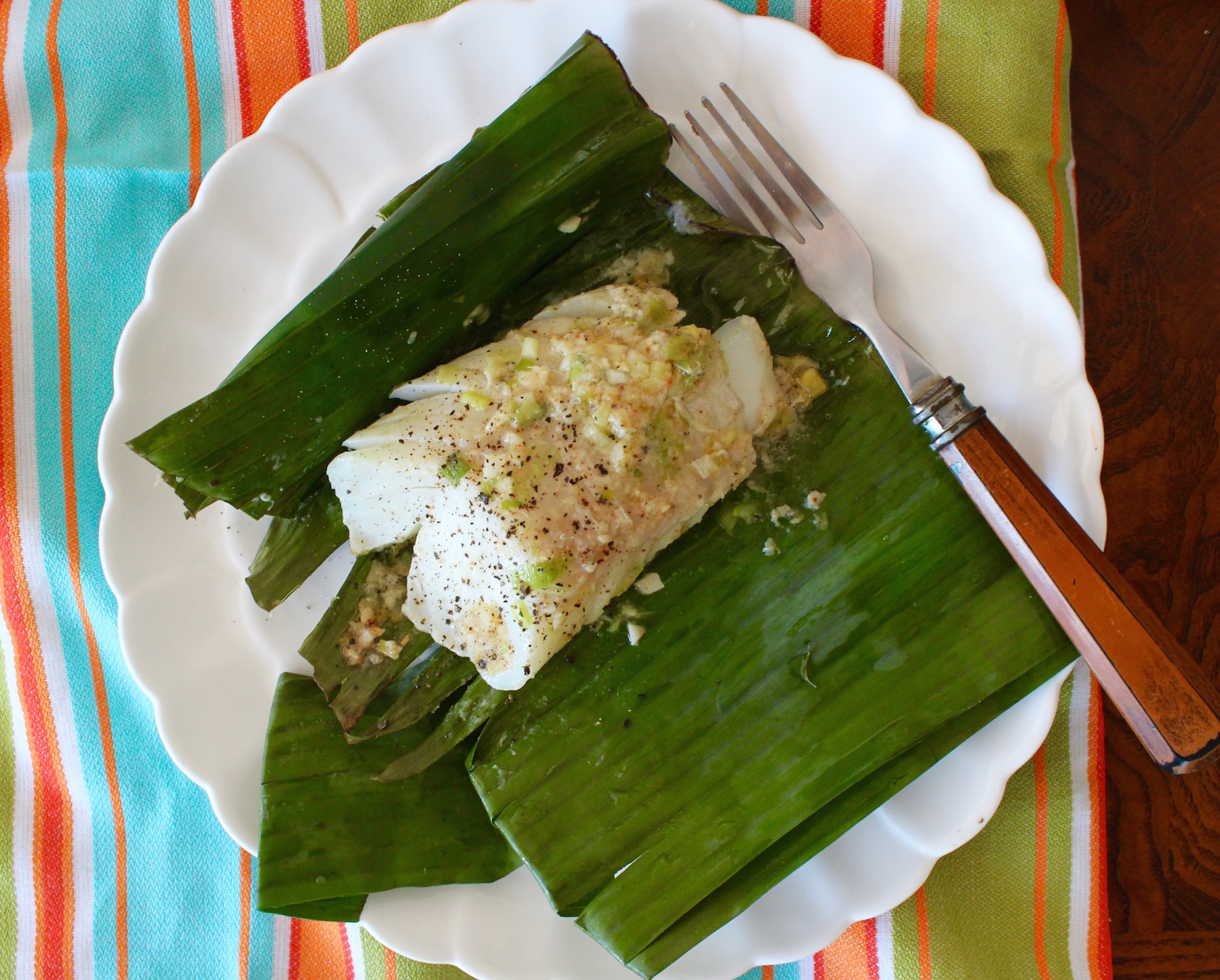 cod in banana leaves on plate