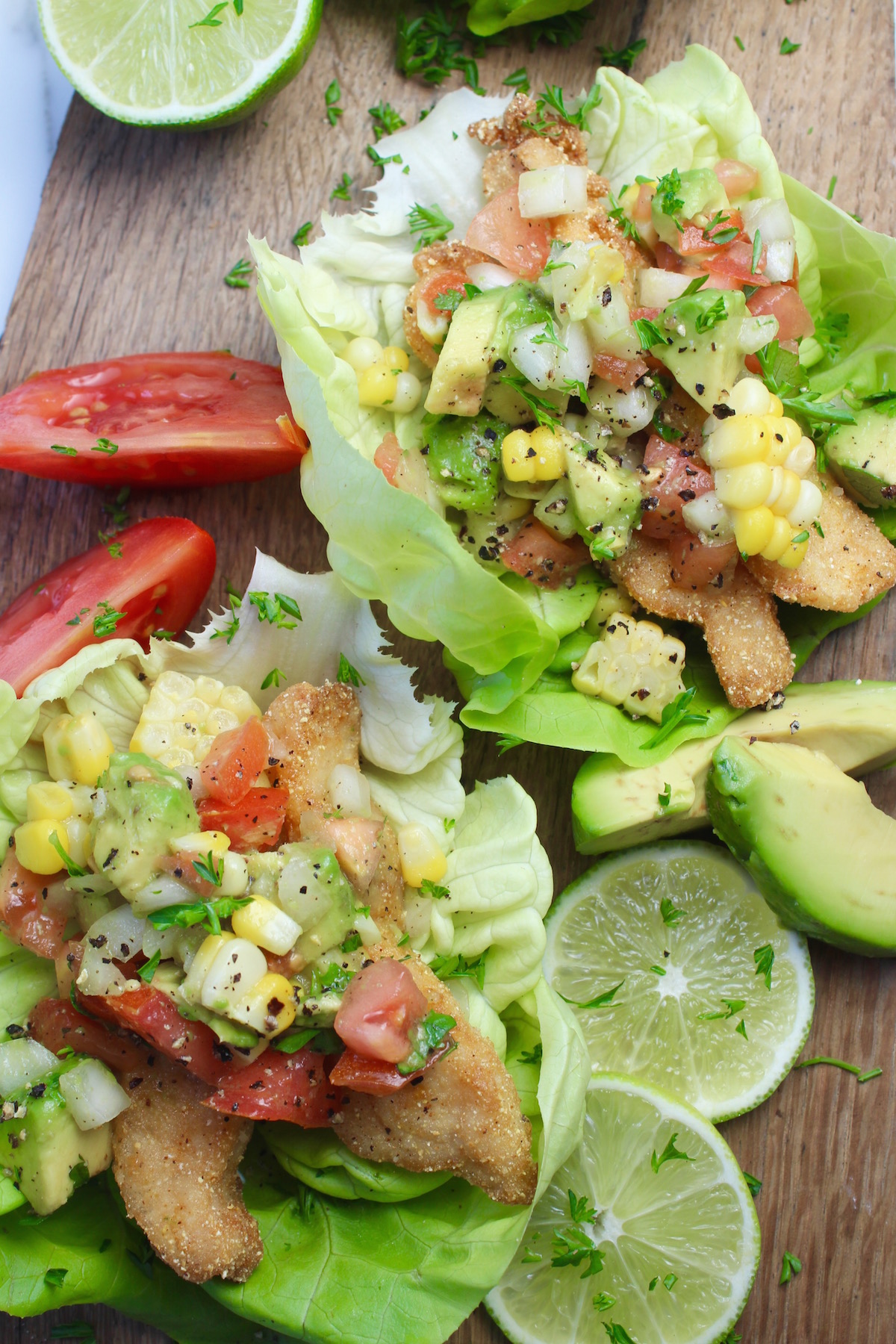 lettuce fish tacos on cutting board